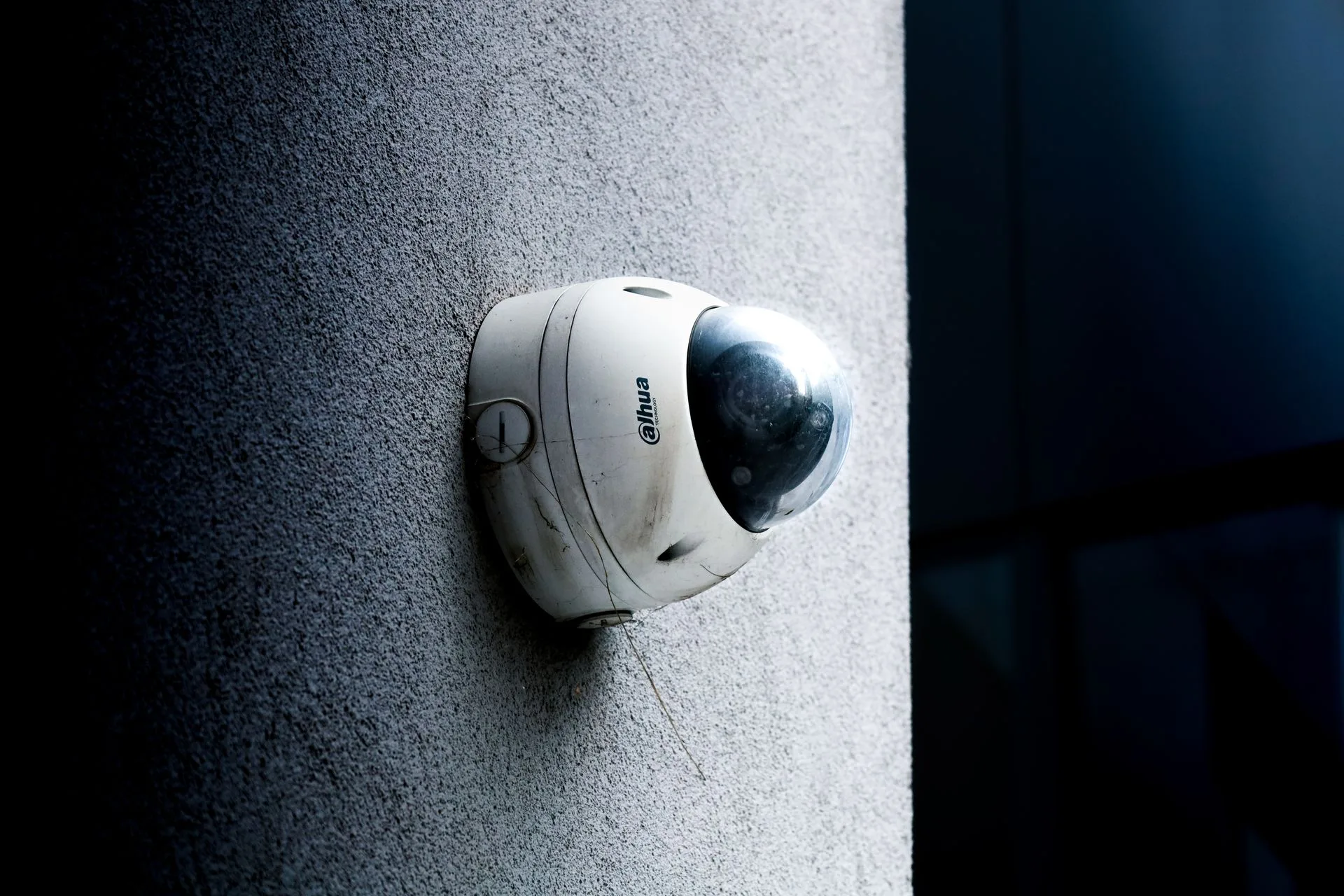 Dome CCTV security camera mounted on a wall